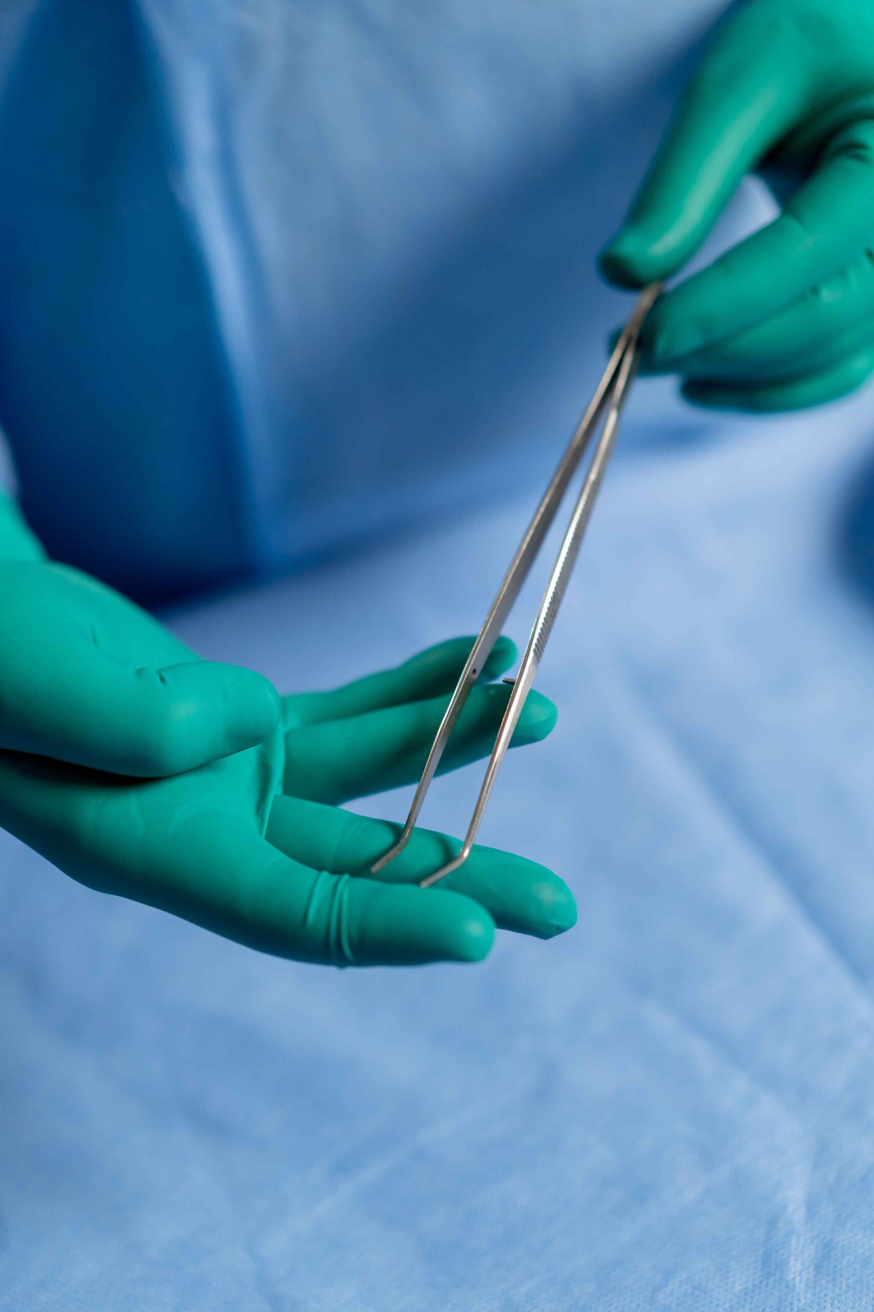 Surgeon holding surgical forceps