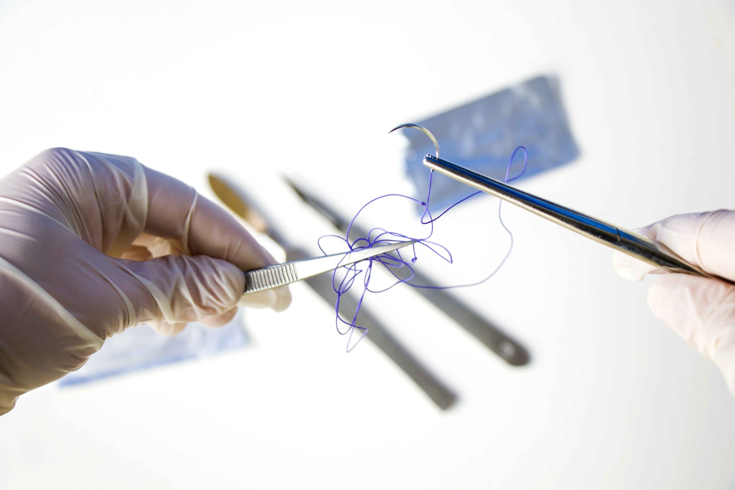Holding surgical needle & tangled suture thread